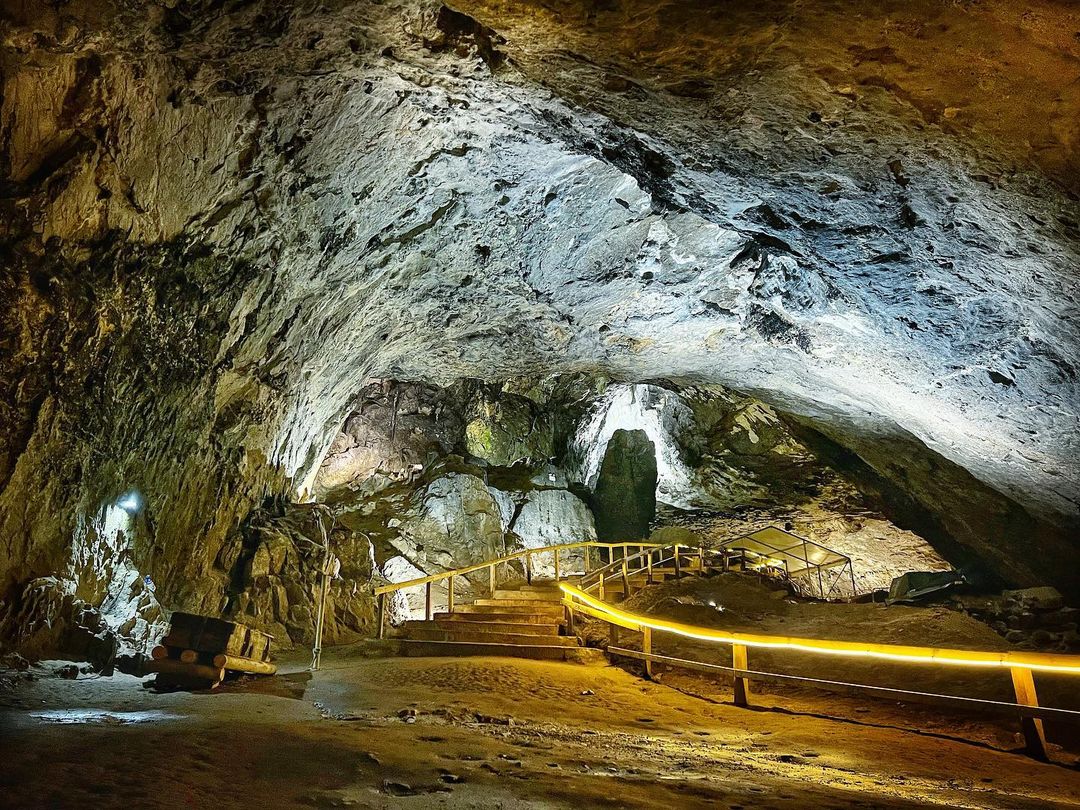 Children exploring Peak Cavern and Castleton caves in the Peak District